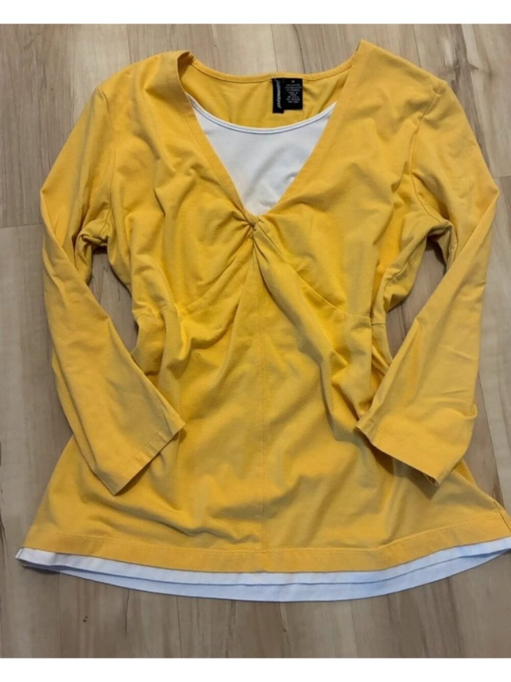 yellow long-sleeved blouse with a V-neck